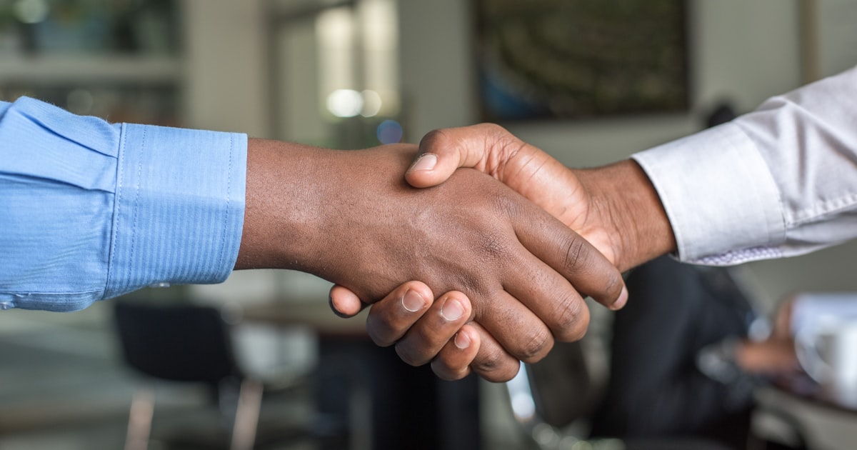 Employer and employee handshake